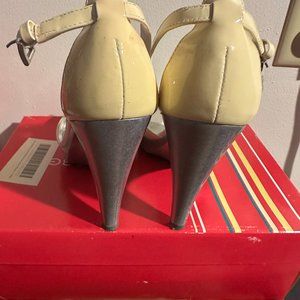 Beautiful BCBGirls White Patent heels with silver on the bottom  Size 7.5/ 37.5